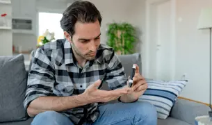A man measures blood sugar