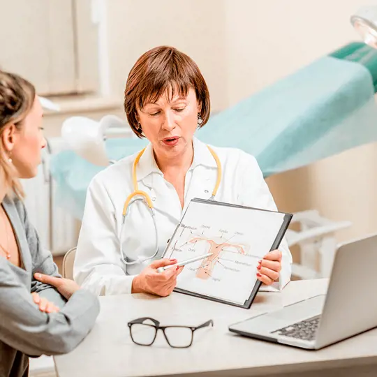 A woman being examined by a gynecologist